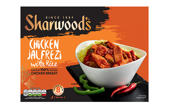 Front of pack image for Sharwoods frozen curry ready meals, featuring a food photograph of chicken jalfrezi with rice served in a white bowl on a slate slab