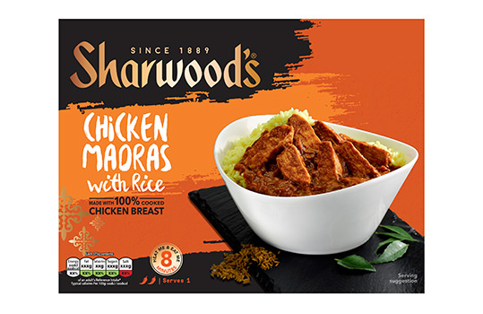 Front of pack image for Sharwoods frozen curry ready meals, featuring a food photograph of chicken jalfrezi with rice served in a white bowl on a slate slab