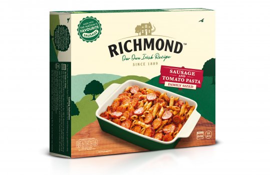 Food photograph of a family sized baking dish filled with Richmond sausage and tomato pasta, on the front of a pack of Richmond sausage and tomato pasta ready meal