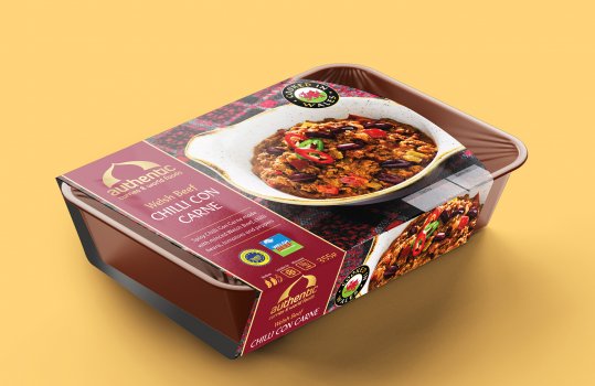 Digital render of a ready meal curry in a plastic tray with a cardboard sleeve featuring a food photograph of the curry inside the pack, plated up and placed on a patterned tablecloth